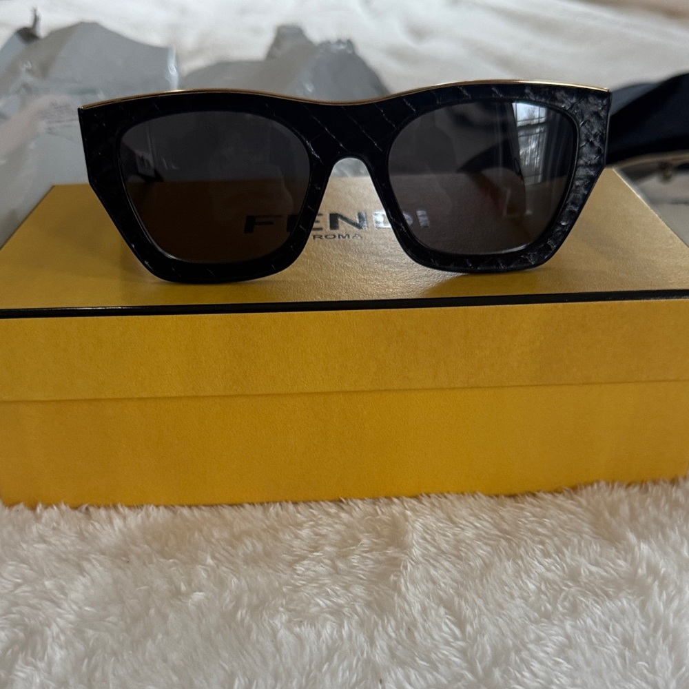Brand new in box limited edition fendi sunglasses. The black leather edition.